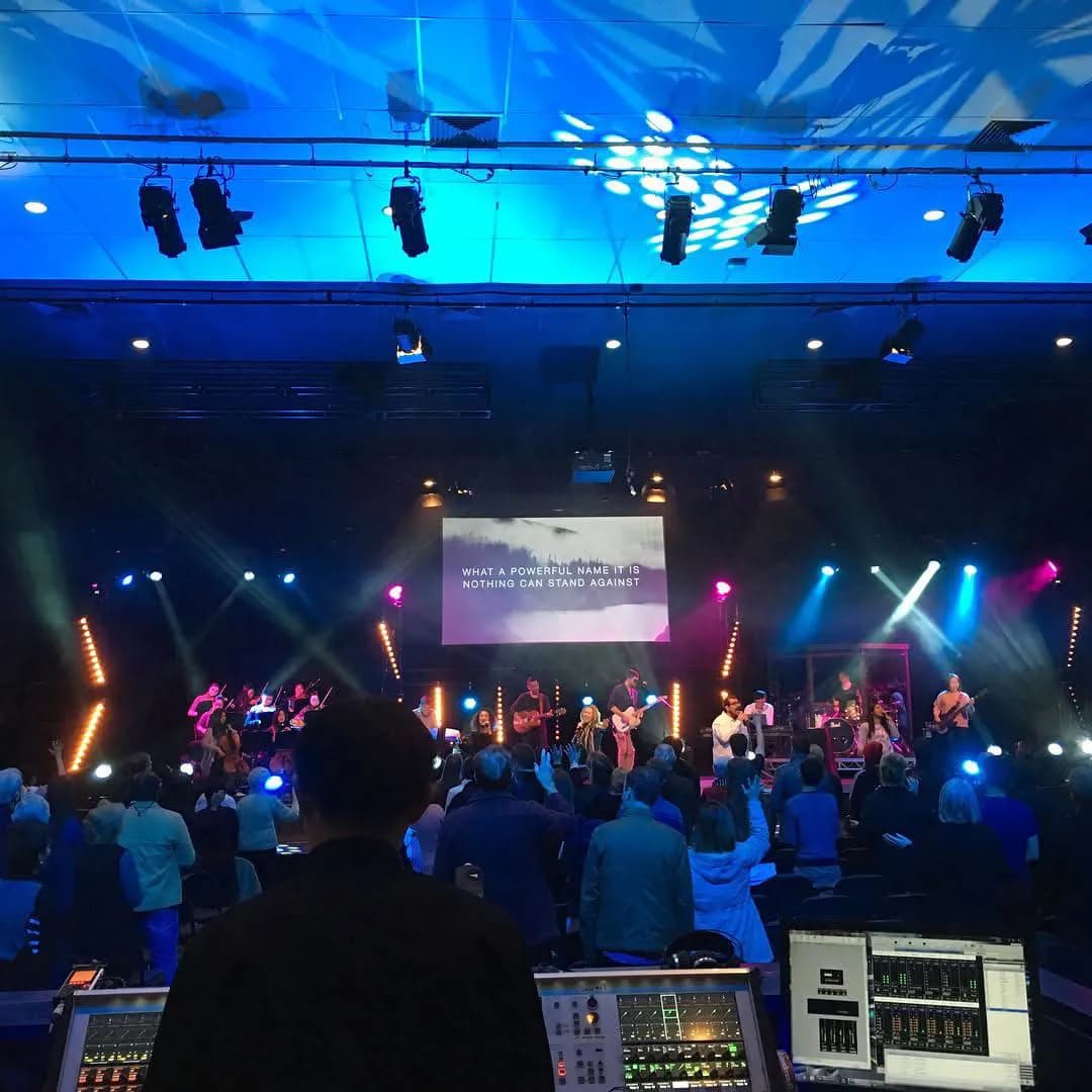Sound engineer with crowd and stage in view